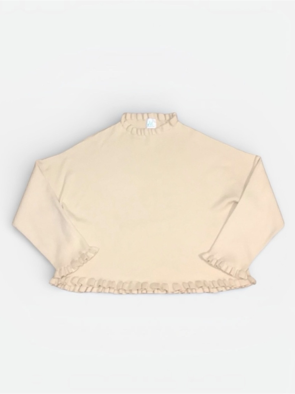 Shop The Mint Ribbed Ruffle Hem Knit Top in Vanilla Size Small